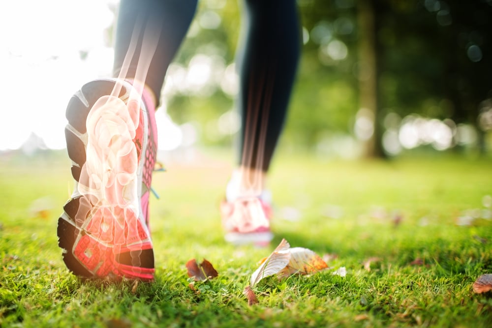 Digital composite of Highlighted foot bones of jogging woman-1